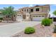 Inviting two-story home features manicured landscaping, multi-car garage, and a neutral color palette at 31221 N 130Th Ln, Peoria, AZ 85383