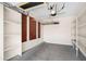 Spacious garage featuring built-in shelving and ample storage at 31221 N 130Th Ln, Peoria, AZ 85383