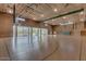 Spacious gymnasium with high ceilings, basketball hoops, and ample natural light at 31221 N 130Th Ln, Peoria, AZ 85383