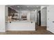 Modern kitchen with granite counters, stainless steel appliances, dark cabinets and stainless refrigerator at 31221 N 130Th Ln, Peoria, AZ 85383