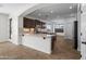 Spacious kitchen with granite countertops, dark cabinetry, stainless steel appliances, and open design at 31221 N 130Th Ln, Peoria, AZ 85383