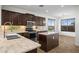 Modern kitchen featuring granite countertops, stainless steel appliances, and an island at 31221 N 130Th Ln, Peoria, AZ 85383