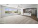 Open floor plan with bright and airy living room with backyard view, flowing into the kitchen at 31221 N 130Th Ln, Peoria, AZ 85383