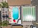 Aerial view of community featuring a large pool, shuffleboard courts, and poolside seating area at 4065 E University -- # 433, Mesa, AZ 85202