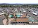 A sprawling aerial shot shows the community pool, clubhouse, and lush landscaping of a well-designed community at 4065 E University -- # 433, Mesa, AZ 85202