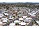 An expansive aerial view showcases the community's layout, featuring a central pool, tennis courts, and palm-lined streets at 4065 E University -- # 433, Mesa, AZ 85202