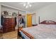 Bedroom with a four-post bed, ceiling fan, and closet at 4065 E University -- # 433, Mesa, AZ 85202