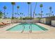 Enjoy the refreshing community pool, surrounded by palm trees and lounge chairs, perfect for relaxation at 4065 E University -- # 433, Mesa, AZ 85202
