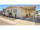 Charming single-story home with desert landscaping, carport, and decorative touches at 4065 E University -- # 433, Mesa, AZ 85202