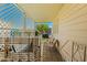 Outdoor patio featuring tiled floor, lattice work, patio furniture and stairs to backyard at 4065 E University -- # 433, Mesa, AZ 85202