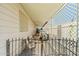 Enclosed patio area with lattice walls, furniture and gated entrance to the home at 4065 E University -- # 433, Mesa, AZ 85202