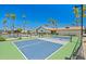 Outdoor pickleball courts with lush landscaping and palm tree lined perimeter at 4065 E University -- # 433, Mesa, AZ 85202