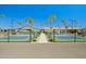 Outdoor pickleball courts offer a fun recreational activity amid lush landscaping and clear blue skies at 4065 E University -- # 433, Mesa, AZ 85202