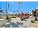Poolside patio with tables, chairs, umbrellas, and a barbecue grill offers a perfect outdoor space at 4065 E University -- # 433, Mesa, AZ 85202