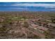 Aerial view of a desert community featuring luxury homes, golf course, and mountain views at 42101 N Olympic Fields Ct, Anthem, AZ 85086