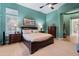 Main bedroom featuring accent color walls and shutters at 42101 N Olympic Fields Ct, Anthem, AZ 85086