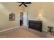 Bedroom with carpet, door to another room and neutral paint colors at 42101 N Olympic Fields Ct, Anthem, AZ 85086