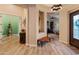 Inviting entryway with tile floors, wooden bench, and arched doorways at 42101 N Olympic Fields Ct, Anthem, AZ 85086