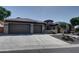 Beautiful home with a three car garage and stone accents at 42101 N Olympic Fields Ct, Anthem, AZ 85086