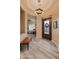 Foyer featuring chandelier lighting and views into the living space at 42101 N Olympic Fields Ct, Anthem, AZ 85086