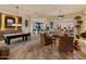 The game room has a pool table, wet bar, and hardwood floors at 42101 N Olympic Fields Ct, Anthem, AZ 85086