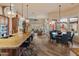 Open floor plan showcasing the kitchen island, dining area, and comfortable living room with scenic views at 42101 N Olympic Fields Ct, Anthem, AZ 85086