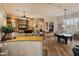 Open concept living area with fireplace and billiard room, great for entertaining and relaxation at 42101 N Olympic Fields Ct, Anthem, AZ 85086