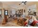 Spacious living room features a billiards table and cozy seating area perfect for entertaining at 42101 N Olympic Fields Ct, Anthem, AZ 85086