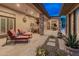 Relax on this expansive covered patio with a seamless flow to the backyard at 42101 N Olympic Fields Ct, Anthem, AZ 85086