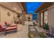 Spacious covered patio with ceiling fans offering a cool and relaxing place to sit and visit with Gathering or friends at 42101 N Olympic Fields Ct, Anthem, AZ 85086