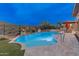 A gorgeous pool and spa are surrounded by desert landscaping at 42101 N Olympic Fields Ct, Anthem, AZ 85086