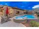 Enjoy this home's refreshing pool, and connected hot tub on a warm day in your backyard at 42101 N Olympic Fields Ct, Anthem, AZ 85086