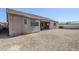 View of the gravel-covered backyard with block wall at 43205 W Oster Dr, Maricopa, AZ 85138