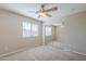 This bedroom offers soft tones, soft carpet and a closet featuring mirrored doors at 43205 W Oster Dr, Maricopa, AZ 85138