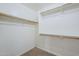 A simple yet functional closet with multiple wooden racks for organized storage at 43205 W Oster Dr, Maricopa, AZ 85138