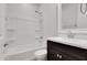 Bathroom featuring shower-tub combo and single vanity with framed mirror at 4853 N 183Rd Ln, Goodyear, AZ 85395