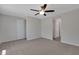 Neutral bedroom boasts soft carpeting and a ceiling fan for added comfort at 4853 N 183Rd Ln, Goodyear, AZ 85395