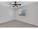 Carpeted bedroom with natural light and ceiling fan for added comfort at 4853 N 183Rd Ln, Goodyear, AZ 85395