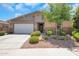 Charming single-story home featuring well-kept landscaping and a two-car garage, enhancing its curb appeal at 4853 N 183Rd Ln, Goodyear, AZ 85395
