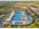 Community pool with slides and recreational facilities, surrounded by neighborhood and trees at 4960 E Colonial Dr, Chandler, AZ 85249