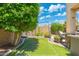 Backyard lawn area with a soccer net, perfect for outdoor play and recreation at 4960 E Colonial Dr, Chandler, AZ 85249