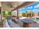 Expansive covered patio with a built-in grill, outdoor seating, and pool view perfect for outdoor living at 4960 E Colonial Dr, Chandler, AZ 85249