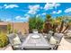 Outdoor dining area with an elegant table and lush landscaping, perfect for entertaining at 4960 E Colonial Dr, Chandler, AZ 85249