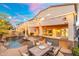 Inviting backyard features a pool, covered patio, and an outdoor kitchen area at 4960 E Colonial Dr, Chandler, AZ 85249