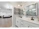 Modern bathroom with double sinks, luxury finishes, and open design to the bedroom at 4960 E Colonial Dr, Chandler, AZ 85249