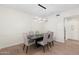Modern dining room features stylish table, chairs, and contemporary light fixture at 4960 E Colonial Dr, Chandler, AZ 85249