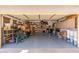 Spacious garage with epoxy flooring, shelving, and ample storage space for vehicles and equipment at 4960 E Colonial Dr, Chandler, AZ 85249