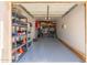 View of the garage with shelving units for storage and epoxy flooring at 4960 E Colonial Dr, Chandler, AZ 85249