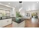 Open kitchen featuring an island with seating, stainless steel appliances, and granite countertops at 4960 E Colonial Dr, Chandler, AZ 85249