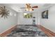 Spacious living room features a ceiling fan, decorative art, and hardwood floors at 4960 E Colonial Dr, Chandler, AZ 85249